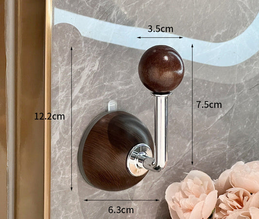 Wooden hook with measurements on a marble wall background
